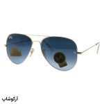 عکس از عینک آفتابی Ray-Ban با فریم خلبانی، رنگ طلایی، لنز از جنس سنگ، آبی تیره و هایلایت مدل RB3026 HQ
