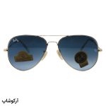 عکس از عینک آفتابی Ray-Ban با فریم خلبانی، رنگ طلایی، لنز از جنس سنگ، آبی تیره و هایلایت مدل RB3026 HQ