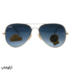عکس از عینک آفتابی Ray-Ban با فریم خلبانی، رنگ طلایی، لنز از جنس سنگ، آبی تیره و هایلایت مدل RB3026 HQ