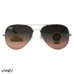 عکس از عینک آفتابی Ray-Ban با فریم خلبانی، رنگ نقرهای، لنز سنگ و قهوهای تیره و هایلایت مدل RB3026 HQ
