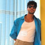 عکس از عینک آفتابی Ray-Ban با فریم ویفرر، لنز شیشه و مدل RB2140 بر روی صورت