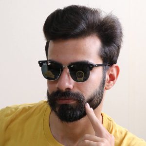 عکس از عینک آفتابی Ray-Ban با فریم کلاب مستر و لنز از جنس سنگ مدل RB3016 بر روی صورت محمدحسین ابراهیم زاده