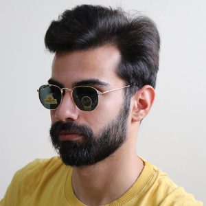 عکس از عینک آفتابی Ray-Ban با فریم شکل چندضلعی و لنز جنس سنگ مدل RB3548 بر روی صورت محمدحسین ابراهیم زاده