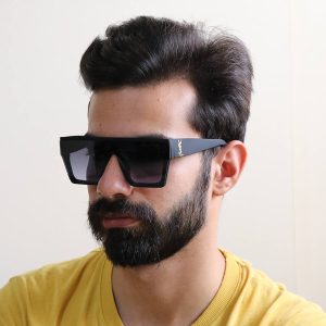 عکس از عینک آفتابی مردانه YSL با فریم مربعی شکل مدل SLM58 بر روی صورت محمدحسین ابراهیم زاده