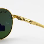 عکس از عینک آفتابی Ray-Ban با فریم خلبانی، بیس دار، طلایی رنگ، لنز سبز تیره، آنتی رفلکس و از جنس شیشه مدل RB8327